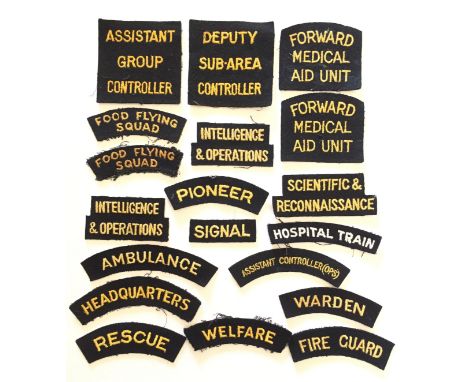 18 Civil Defence cloth shoulder titles. Yellow on navy examples including  ASSISTANT GROUP CONTROLLER ... DEPUTY SUB-AREA CON
