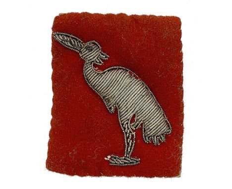 Badge. Indian Army. 404 (East Bengal) L of C Area WW2 cloth formation sign. Bullion paddy-bird embroidered on red rectangle. 
