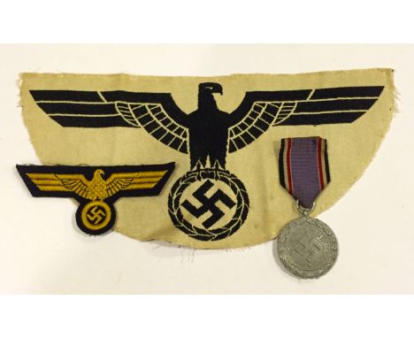 German Third Reich Luftschutz Medal, sports vest eagle and breast eagle. 1938 Luftschutz Service Medal, lightweight example m