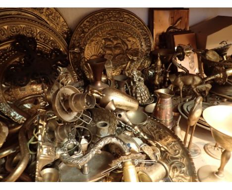 Large quantity of brassware wall plaques light sconces bowls bells figurines candle snuffer etc 
