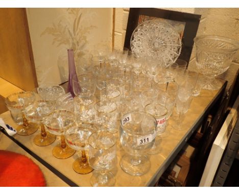 Shelf of glassware sets of wine glasses tumblers shot glasses seven decanter tops etc 