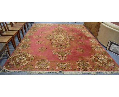 A machine made carpet of Oriental design, 300cm high by 386cm