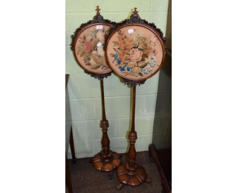 Pair of Victorian rosewood firescreens with circular tapestry panels  
