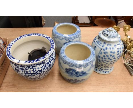 A pair of Chinese blue and white planters decorated with landscapes, a blue and white prunus decorated planter and a Chinese 