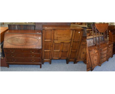 A reproduction mahogany bureau; an oak bureau cabinet; a small reproduction sideboard and a bobbin turned drop leaf table (4)
