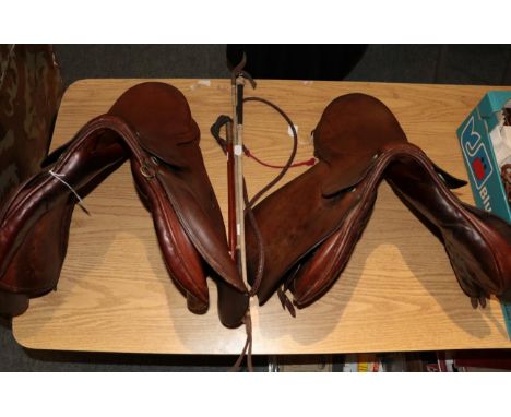 Springtree 17'' jumping saddle; Swaine Adenery 16'' G.P saddle; hunting whip; and two riding crops 