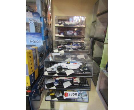 13 Minichamps 1:43 scale diecast Formula 1 cars in perspex cases 