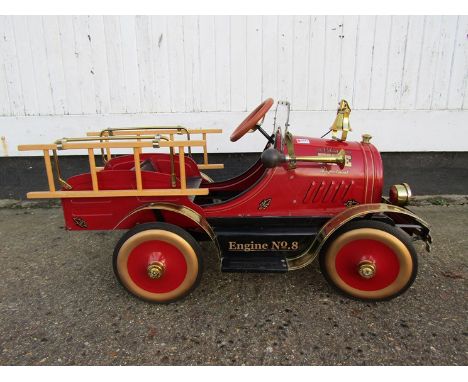 A pedal fire engine with bell and horn "Volunteer Fire Department" limited edition no. 498 of 2999