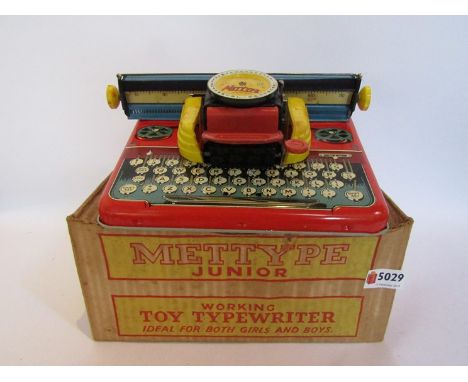 A boxed Mettype Junior typewriter 