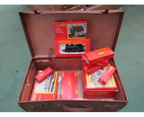 A Hornby 00 gauge R.041 GWR 0-6-0 Pannier tank loco together with an assortment of rolling stock and trackside buildings and 