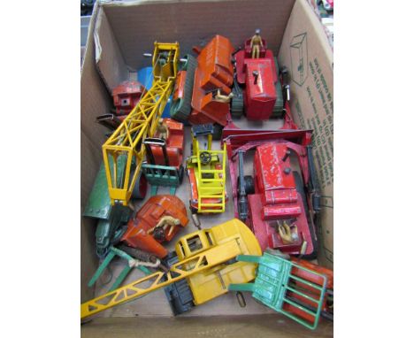 A collection of Dinky diecast vehicles including bulldozers, fork lifts, cranes etc