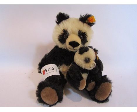 A Steiff panda and cub 