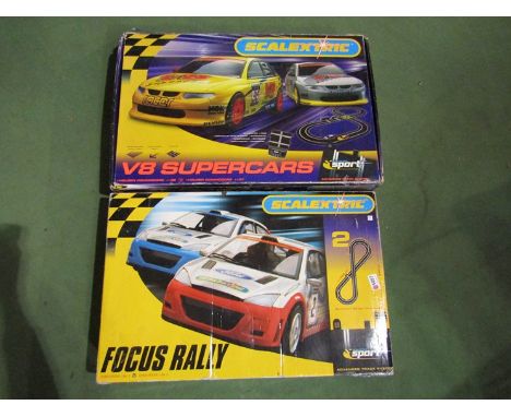 Two Scalextric sets- Focus Rally and V8 Supercars with FOrd and Mercedes cars