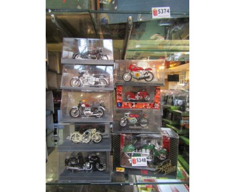 A collection of diecast motorcycles including Maisto Vespas, Harley-Davidson motorbike and sidecar 