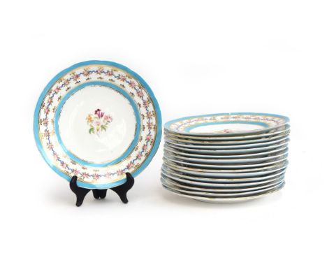 A set of 16 Coalport plates, light blue border heightened in gilt, central floral spray decoration, 24cm diameter, a pair of 