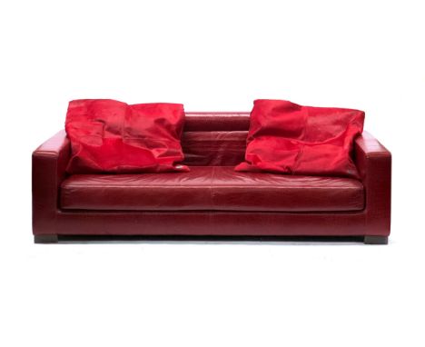 A Fendi Casa three seater sofa, faux crocodile upholstered finish, with two Fendi cowhide cushions, 230cm wide, 105cm deep, 7