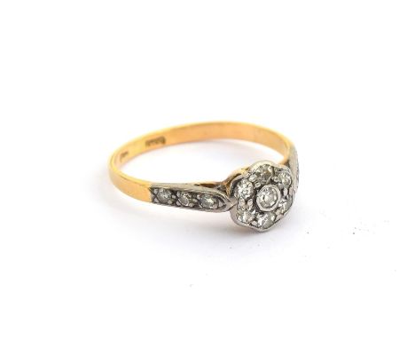 An early 20th century gold and diamond floral cluster ring, marks rubbed but tests as 14ct or higher, size K 1/2, 1.7g 