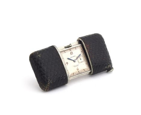 A Movado Chronometre Ermeto purse travel watch, the leather case opening to reveal a signed white dial with Arabic numerals, 