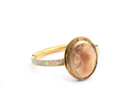 A Georgian gold mourning ring, the white enamel band engraved 'Robt Lawrence OB 26 Apr 1774 AE 40', later mounted with a carv