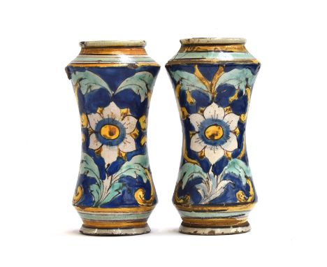 A pair of Italian 17th century majolica albarello apothecary jars, likely Sicilian, one repaired, of waisted form with a larg