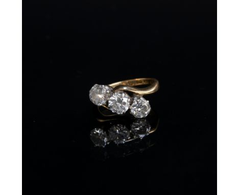 An 18ct gold and diamond trilogy crossover ring, total carat weight approx. 1.6cts, size K, hallmarked for Birmingham, 1968, 