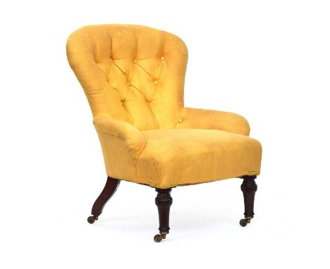 A Victorian button back slipper chair by Holland &amp; Sons, with loose cream cover, on turned front legs and brass casters 