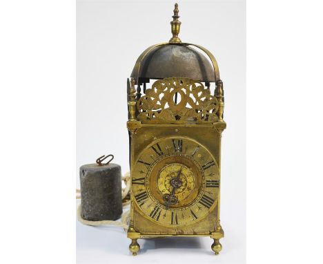 An early English brass lantern clock, the counterwheel bell striking movement with in-frame pedulum swing, the roman numeral 