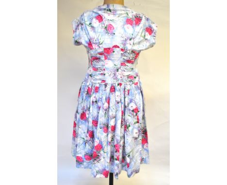 Two 1950s dresses - a pink/white carnation print cotton dress, with label Clayburn Model, London and a blue chiffon dress flo