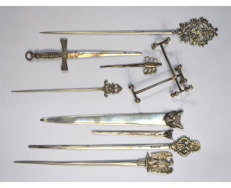 Four various Victorian silver letter knives to/w a later letter knife with a fox's head finial, two Victorian silver skewers 