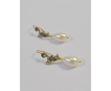 A pair of diamond and pearl drop earrings, the tear-shaped cultured pearl suspended from crescent shaped diamond set drop, wi