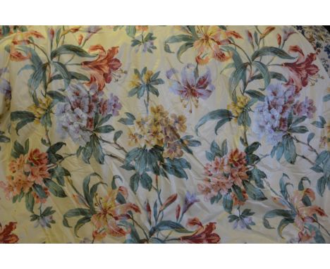 Two pairs of glazed cotton lined and inter-lined curtains with bold floral spray design on pale yellow ground, one pair (each
