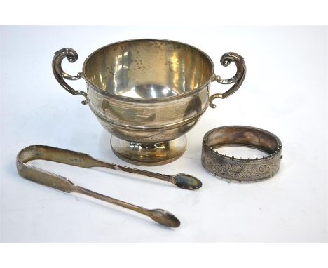 An Edwardian Irish silver sugar basin with twin scroll handles and stemmed foot, maker SIW (not identified), Dublin 1907, to/