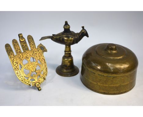 A Brass Hamsa or Hand of The Lady Fatima, 20.5 cm high; together with an Indian or Nepalese votive oil lamp with bird finial,