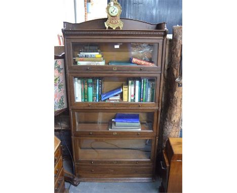 'The Lebus Bookcase' with four graduated glazed oak sections on a single drawer plinth base, 89 x 36 x 170 cm high overall