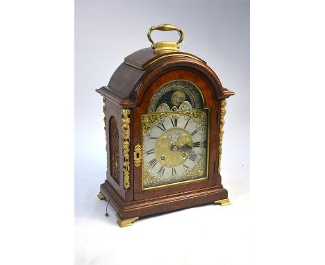 A German burr walnut bracket clock in the 18th century manner, with gilt metal mounts, gilt and silvered dial with moon-phase