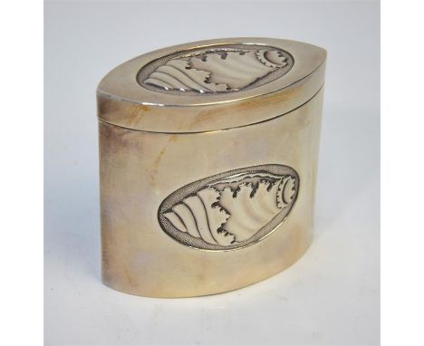 An Edwardian Sheraton revival tea caddy of elliptical form, embossed and chased with oval shell medallions. Thomas Bradbury &