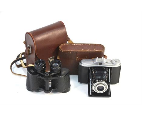 A pair of Carl Zeiss Jenoptem 8 x 30 W binoculars in original leather case, to/w an Agfa Isolette camera with black bellows a
