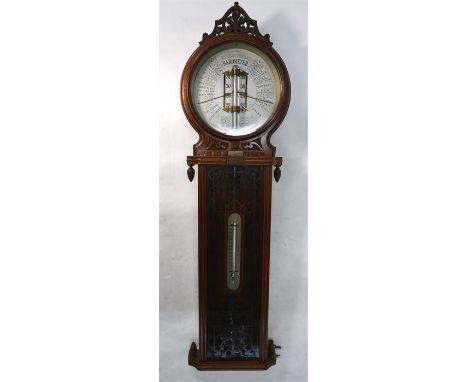 A Victorian mahogany American Forecast Barometer with mercury column and silvered dial glazed fret-cut lower section inset wi