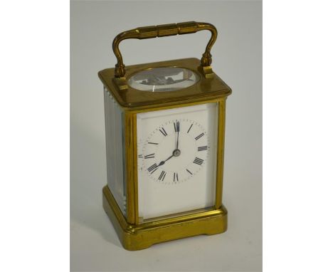 A French brass carriage clock, the eight-day H Jacot movement no 4444 with lever escapement and enamelled dial, 12 cm highGoo