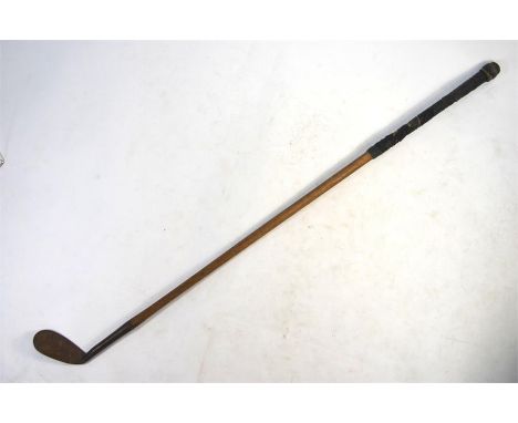A vintage hickory-shafted mashie niblick golf club with 'Guaranteed Forged Special' iron head