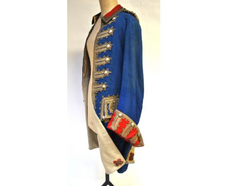 A French 18th century style military jacket with metallic braiding and white metal buttons and a French 18th century style mi