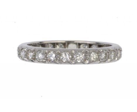 A DIAMOND ETERNITY RING with round brilliant cut diamonds, platinum mount, size S ++In good second hand condition with a few 