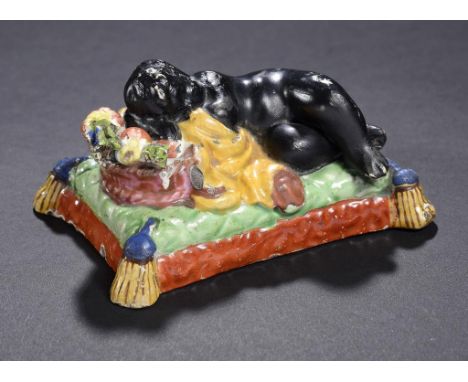 AN UNUSUAL STAFFORDSHIRE PEARLWARE FIGURE OF A CHILD, C1825-30 with overglaze enamel painted decoration, 11.5cm w ++Several s