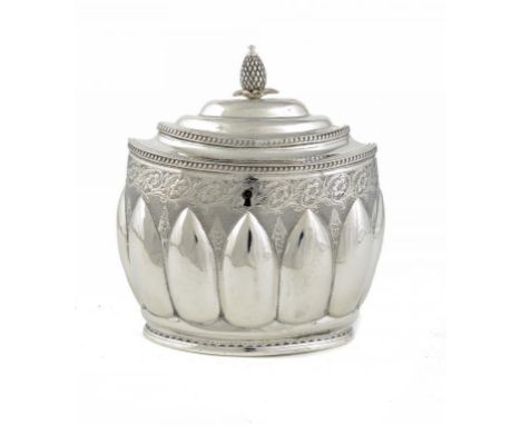 A GEORGE III SILVER TEA CADDY  of deeply lobed oval shape, the domed lid with integral hinge and pineapple knop, 17cm h, by S