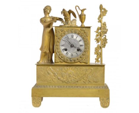 A CHARLES X ORMOLU MANTEL CLOCK, C1830 the movement with silk suspension and silvered dial, the case mounted with the figure 