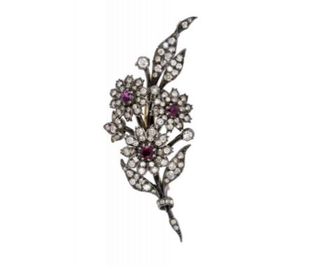 A FINE VICTORIAN RUBY AND DIAMOND THREE FLOWER BROOCH, C1880  in the original royal blue plush box signed for Hunt & Roskell 