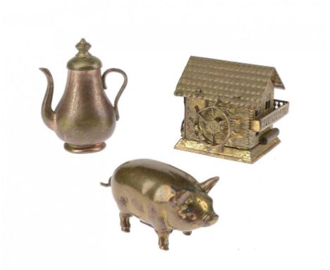 NEEDLEWORK TOOLS.  THREE GILT BRASS NOVELTY TAPE MEASURES, LATE 19TH C comprising a pig, coffee pot and water mill, 4-4.5cm h