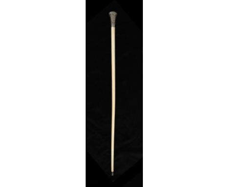 AN INDIAN IVORY ONE-PIECE WALKING CANE, MID 19TH C  the flared silver repoussé handle with scrolling foliage, silver tip, 87c