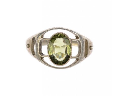 A MURRLE BENNETT & CO SILVER RING, C1905-10  set with a peridot, marked M.B.C. and 950, size O ++In good condition with light