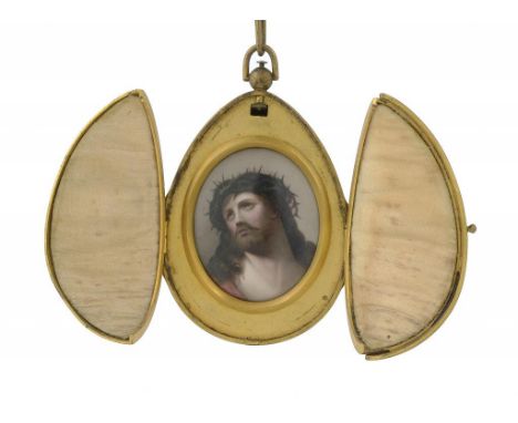 A RUSSIAN GILT BRASS AND ENAMEL EASTER EGG, C1880   opening to reveal a miniature on porcelain of Christ in the crown of thor